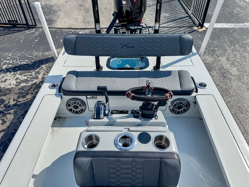 Slide: The Image of Vtech 18Flats 2022 boat interior with steering wheel and seating area. - 10