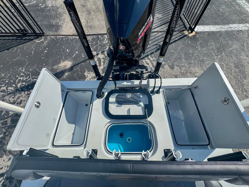 Slide: The Image of Vtech 18Flats 2022 boat with open storage compartments and motor, top view. - 8