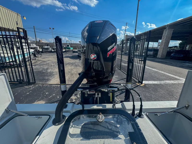 Slide: The Image of Vtech 18Flats 2022 boat with Mercury Pro XS engine at a marina. - 9