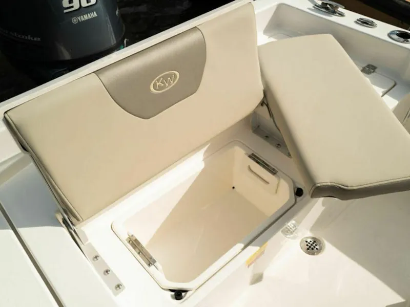 Slide: The Image of 2025 Key West 179 FS boat seat with storage compartment open. - 13