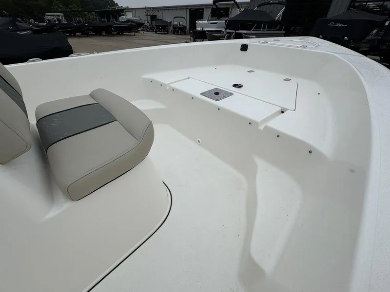 Slide: The Image of 2025 Key West 179 FS boat interior with seating and storage compartments. - 18