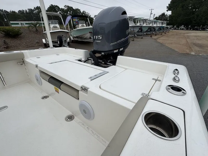 Slide: The Image of 2025 Key West 179 FS boat with Yamaha 115 engine, featuring spacious deck and cup holders. - 19