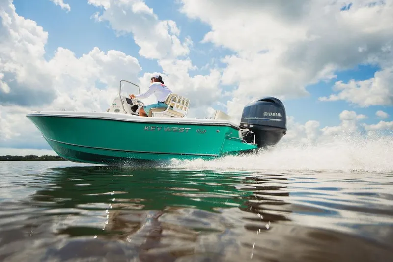 Slide: The Image of 2025 Key West 179 FS boat cruising on water under a cloudy sky. - 21