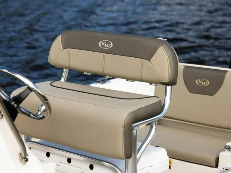 Slide: The Image of 2025 Key West 179 FS boat seating with beige upholstery on a calm water backdrop. - 23
