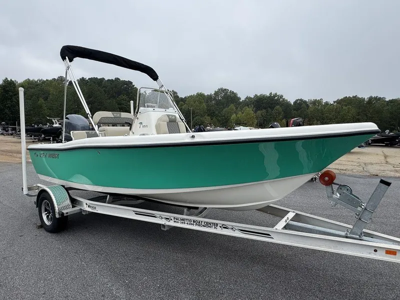 Slide: The Image of 2025 Key West 179 FS boat on trailer, teal hull, parked outdoors. - 3