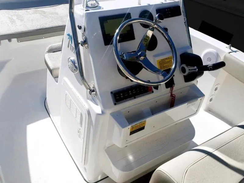 Slide: The Image of 2025 Key West 179 FS boat console with steering wheel and controls. - 8