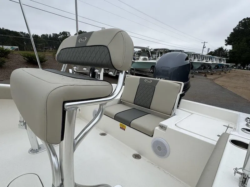 Slide: The Image of 2025 Key West 179 FS boat interior with cushioned seating and sleek design. - 9
