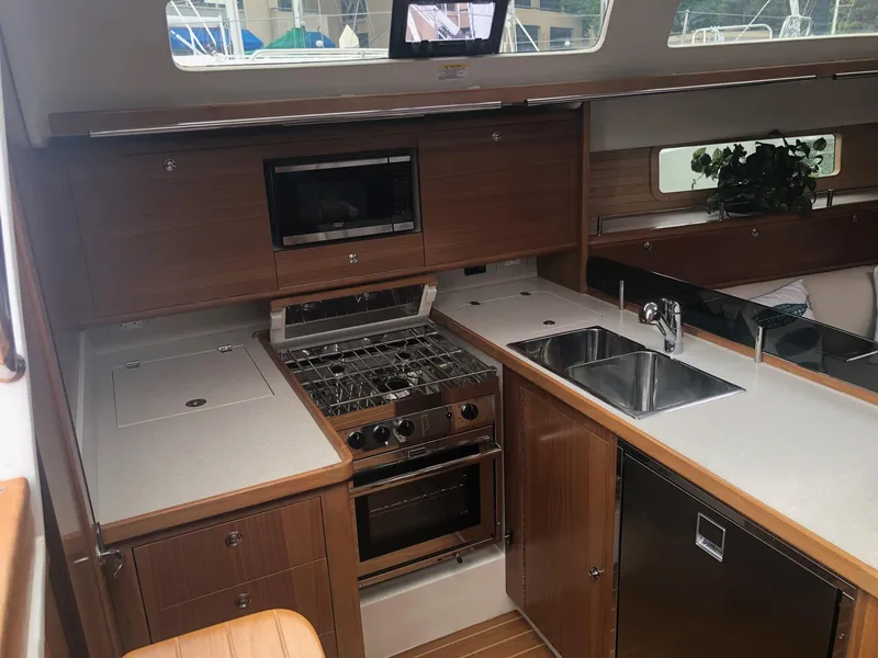 Slide: The Image of Modern kitchen in 2023 Catalina 425 yacht with stove, sink, and microwave. - 15