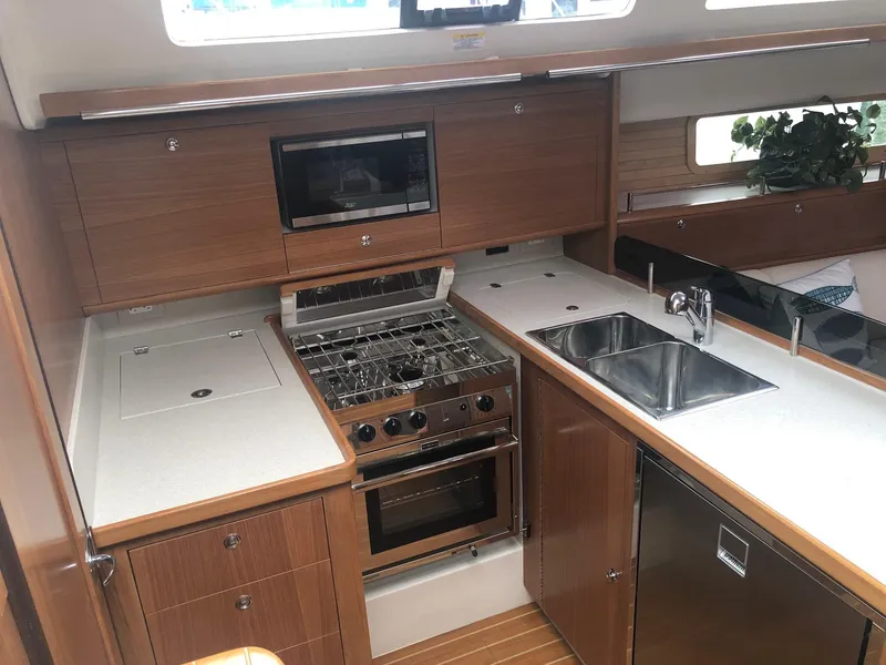 Slide: The Image of Modern kitchen in 2023 Catalina 425 yacht with stove, microwave, and sink. - 16