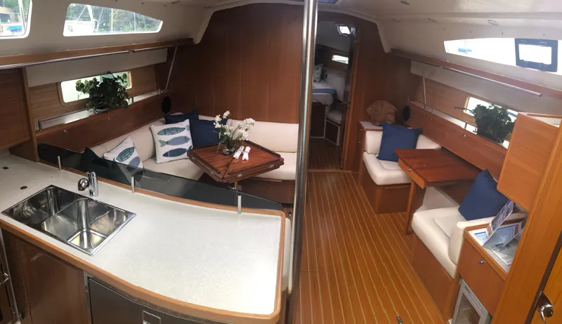Slide: The Image of Interior of 2023 Catalina 425 yacht with modern kitchen and cozy seating area. - 18