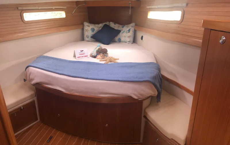 Slide: The Image of Cozy cabin interior of 2023 Catalina 425 sailboat with comfortable bedding and wooden accents. - 20