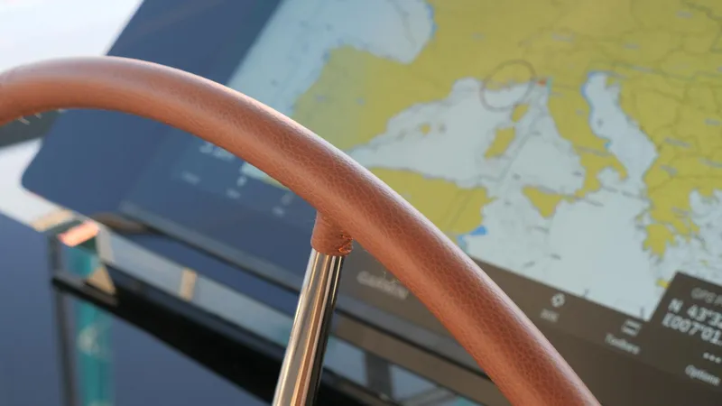 Slide: The Image of Steering wheel and navigation screen on 2025 Fountaine Pajot Thira 80 yacht. - 11