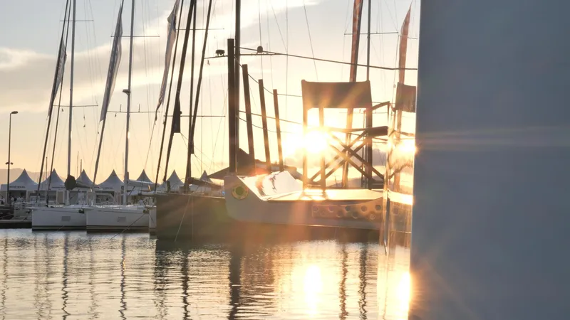 Slide: The Image of Sunset view of Fountaine Pajot Thira 80 yacht, 2025 model, docked at marina. - 14