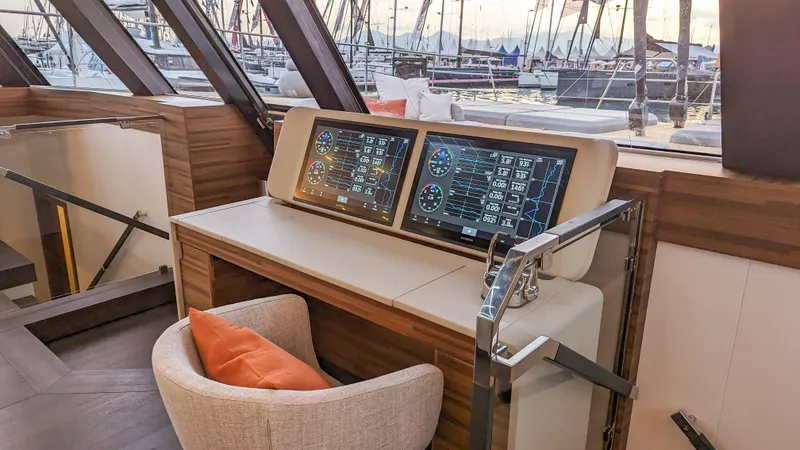 Slide: The Image of Luxurious interior of 2025 Fountaine Pajot Thira 80 yacht with modern navigation displays. - 17