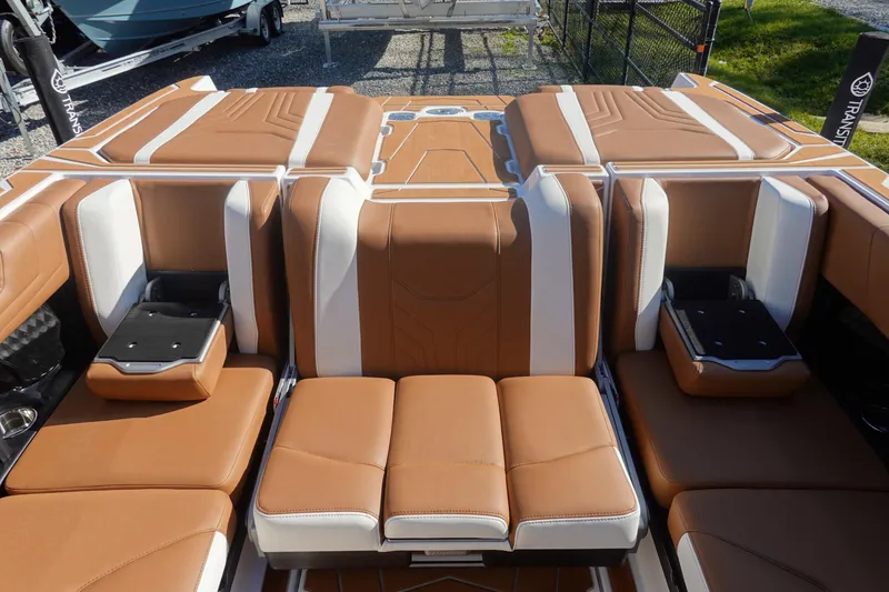 Slide: The Image of 2025 Malibu Wakesetter 25 LSV interior with luxurious tan and white seating. - 14