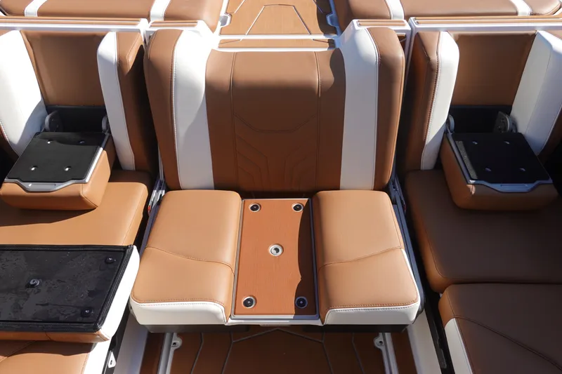 Slide: The Image of Luxurious seating in the 2025 Malibu Wakesetter 25 LSV boat, featuring tan and white upholstery. - 15