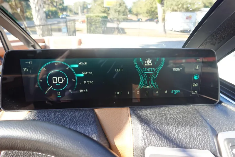 Slide: The Image of 2025 Malibu Wakesetter 25 LSV dashboard display with speedometer and control settings. - 19