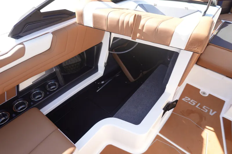 Slide: The Image of 2025 Malibu Wakesetter 25 LSV interior with tan seating and modern design. - 32