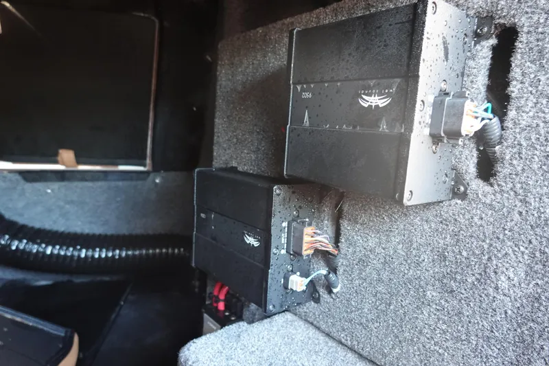 Slide: The Image of 2025 Malibu Wakesetter 25 LSV interior electronics with wiring and components. - 33