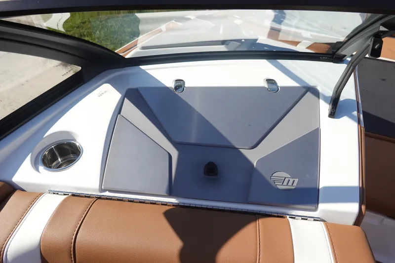 Slide: The Image of 2025 Malibu Wakesetter 25 LSV interior with brown seating and cup holder. - 34