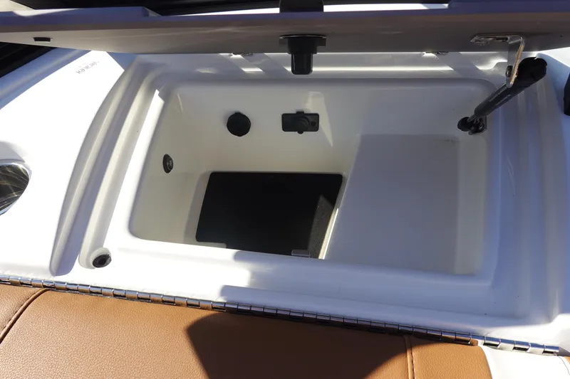 Slide: The Image of Open storage compartment in 2025 Malibu Wakesetter 25 LSV boat. - 35