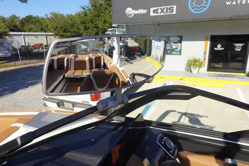 Slide: The Image of 2025 Malibu Wakesetter 25 LSV boat interior and rearview mirror reflection. - 36