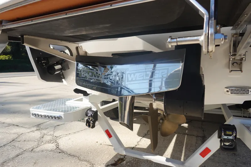 Slide: The Image of 2025 Malibu Wakesetter 25 LSV boat stern with propeller and wake system. - 7