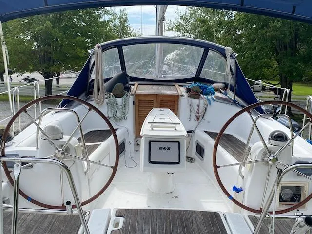 Slide: The Image of 2009 Beneteau Oceanis 40 sailboat cockpit with dual steering wheels and navigation equipment. - 13