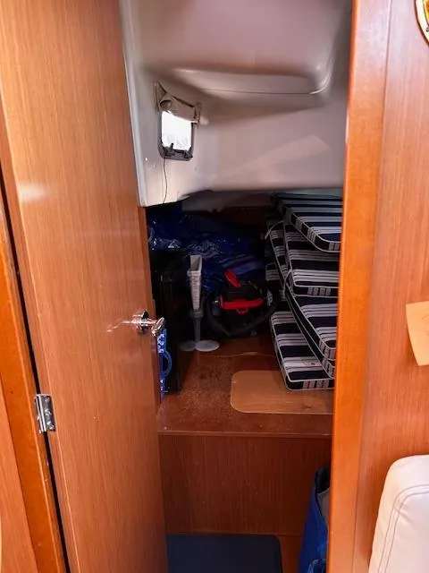 Slide: The Image of Interior storage area of 2009 Beneteau Oceanis 40 sailboat with stacked items. - 20