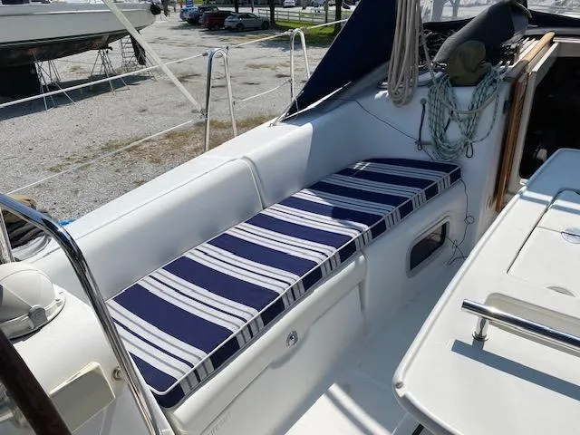 Slide: The Image of 2009 Beneteau Oceanis 40 sailboat cockpit with striped cushions. - 8