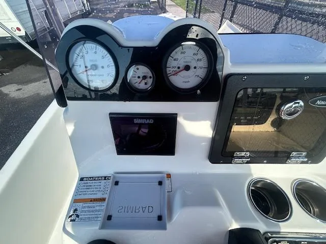 Slide: The Image of 2019 NauticStar 2140 Sport dashboard with gauges and controls. - 14