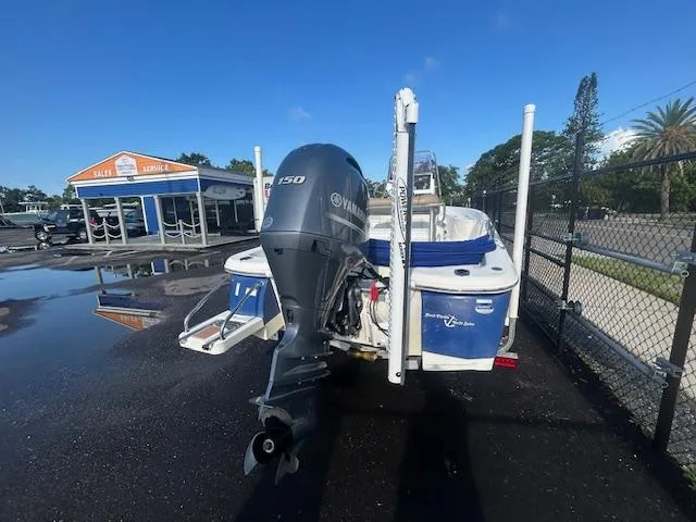 Slide: The Image of 2019 NauticStar 2140 Sport boat with Yamaha outboard motor in a parking lot. - 7