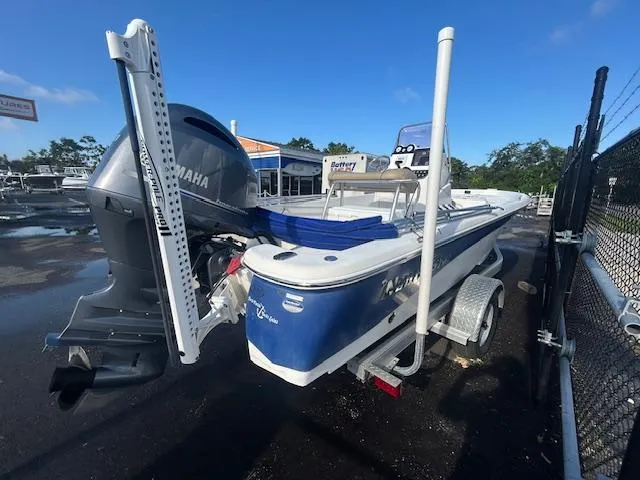 Slide: The Image of 2019 NauticStar 2140 Sport boat with Yamaha engine on trailer, parked outdoors. - 8
