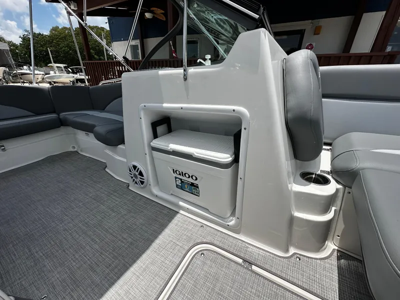 Slide: The Image of 2024 NauticStar 203 DC boat interior with seating and built-in Igloo cooler. - 8