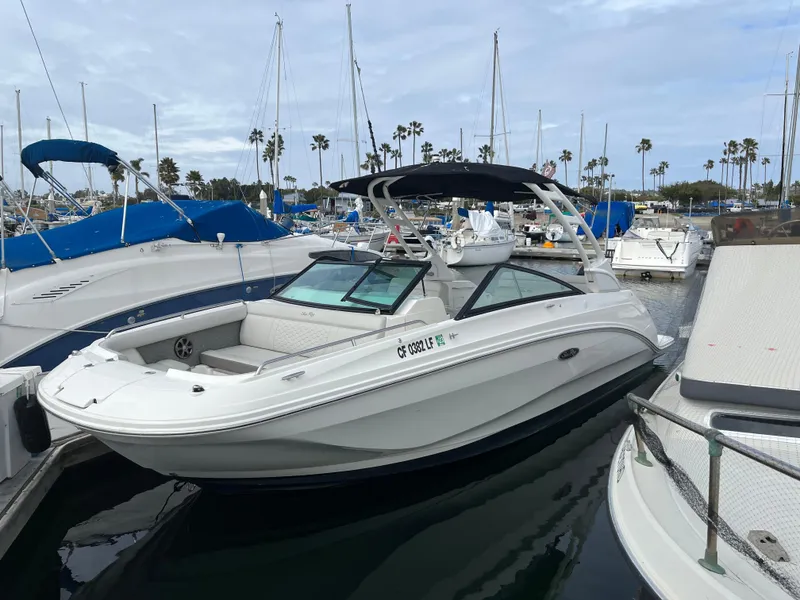Slide: The Image of 2021 Sea Ray SDX 250 Outboard boat docked in a marina. - 4