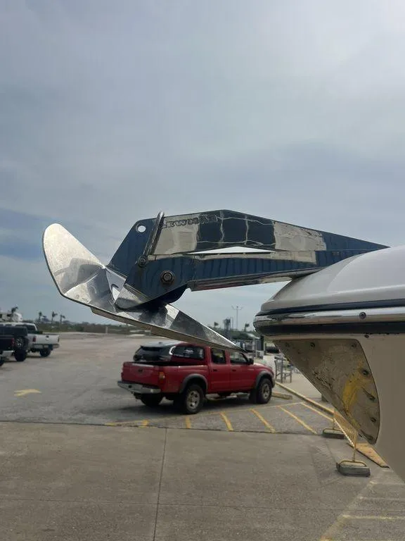 Slide: The Image of 2023 Robalo R242 boat anchor detail in a parking lot setting. - 11