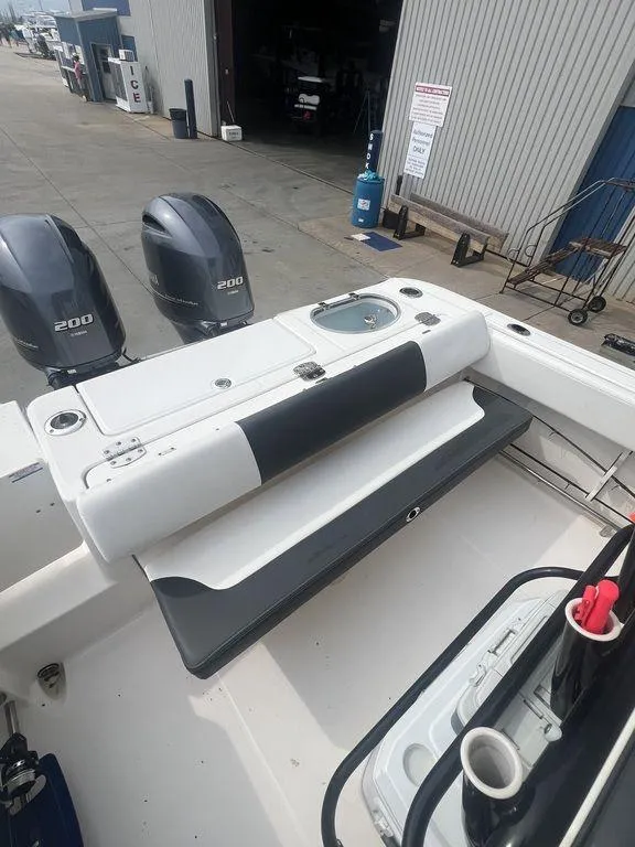 Slide: The Image of 2023 Robalo R242 boat with dual engines and fishing station. - 15