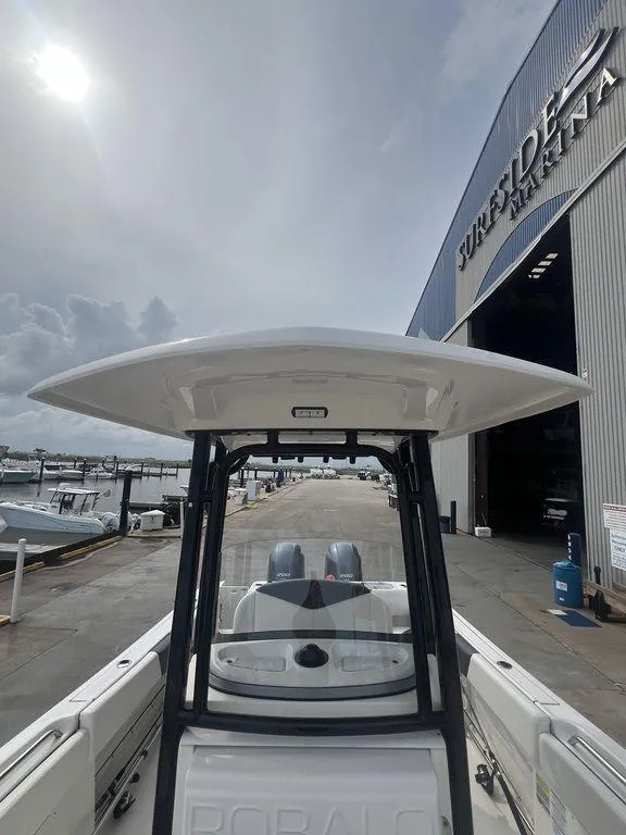 Slide: The Image of 2023 Robalo R242 boat at dockside marina, overcast sky. - 30