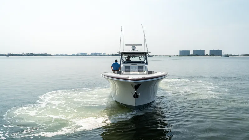 Slide: The Image of 2023 Front Runner 47 Center Console boat on calm water, front view. - 10