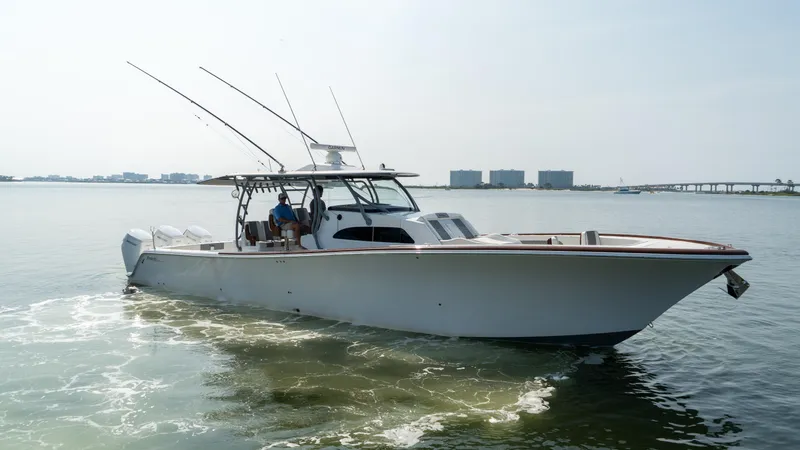 Slide: The Image of 2023 Front Runner 47 Center Console boat cruising on calm waters. - 12