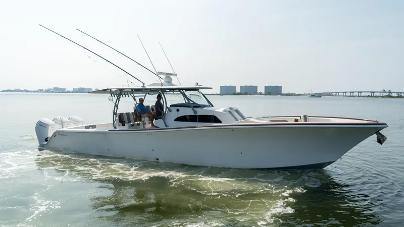 Slide: The Image of 2023 Front Runner 47 Center Console boat cruising on calm waters. - 13