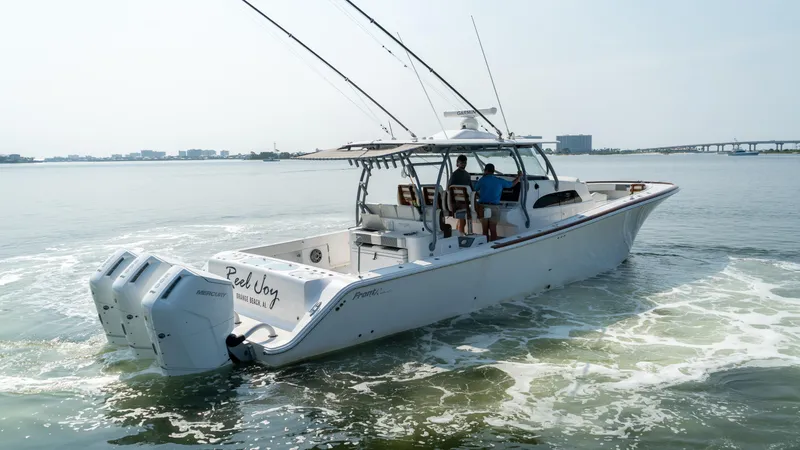 Slide: The Image of 2023 Front Runner 47 Center Console boat cruising on open water. - 18