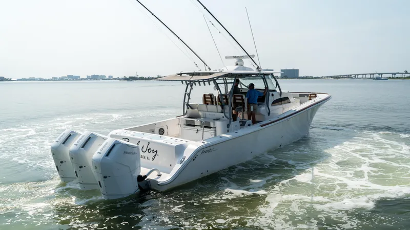 Slide: The Image of 2023 Front Runner 47 Center Console boat cruising on open water. - 19