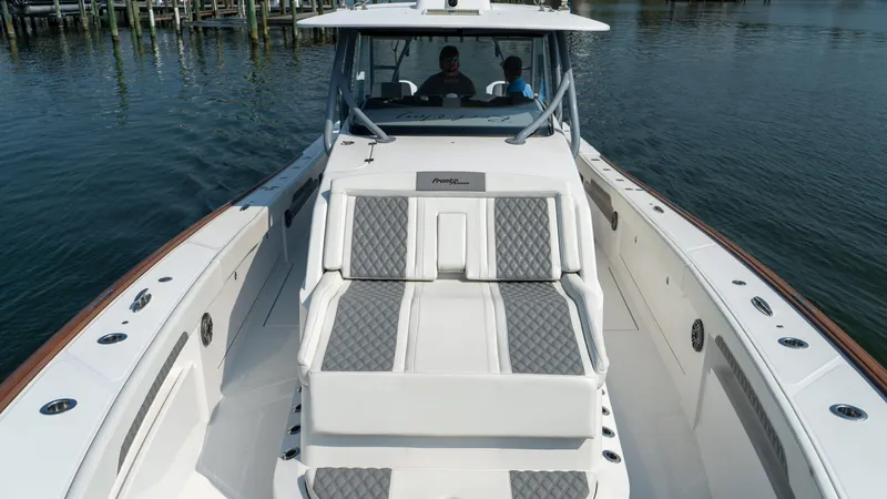 Slide: The Image of 2023 Front Runner 47 Center Console boat on water, featuring spacious seating and sleek design. - 28