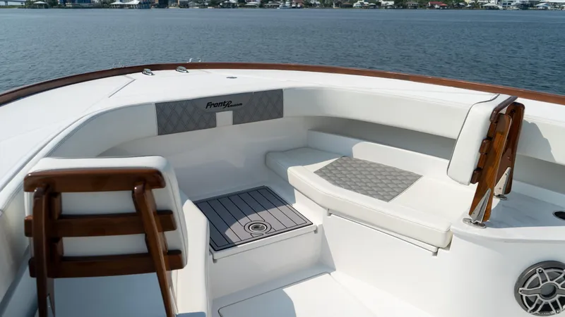 Slide: The Image of 2023 Front Runner 47 Center Console boat interior with seating and wooden accents. - 31