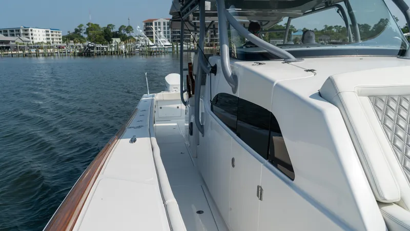 Slide: The Image of 2023 Front Runner 47 Center Console boat on calm water, side view. - 33
