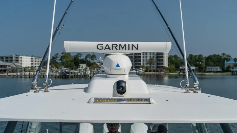 Slide: The Image of 2023 Front Runner 47 Center Console with Garmin radar on calm waters. - 34
