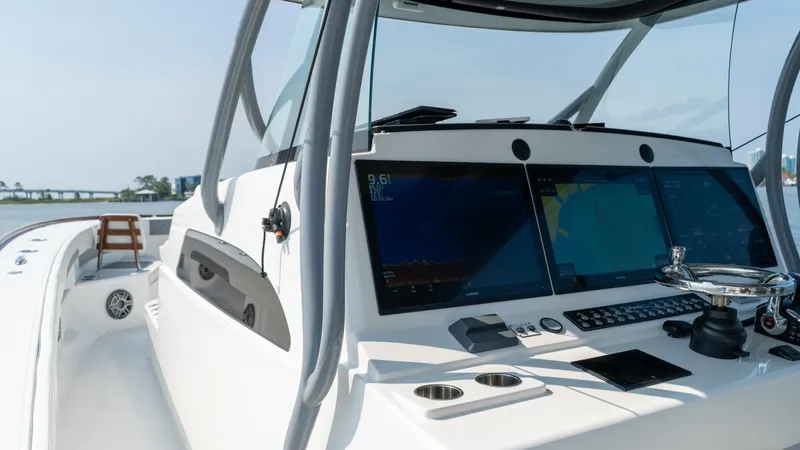 Slide: The Image of 2023 Front Runner 47 Center Console boat with advanced navigation system. - 35