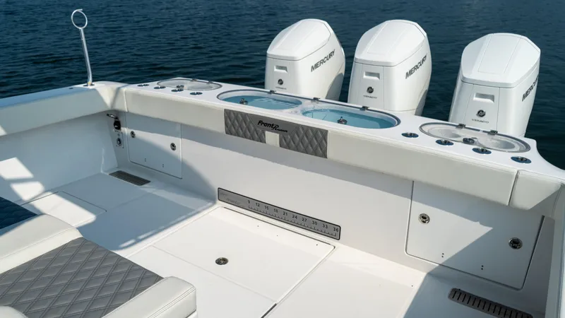 Slide: The Image of 2023 Front Runner 47 Center Console boat with triple Mercury engines. - 46