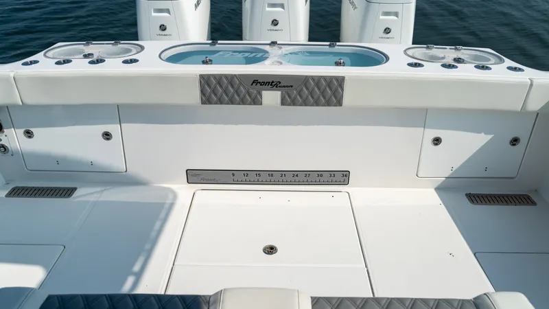 Slide: The Image of 2023 Front Runner 47 Center Console boat deck with fishing amenities. - 47